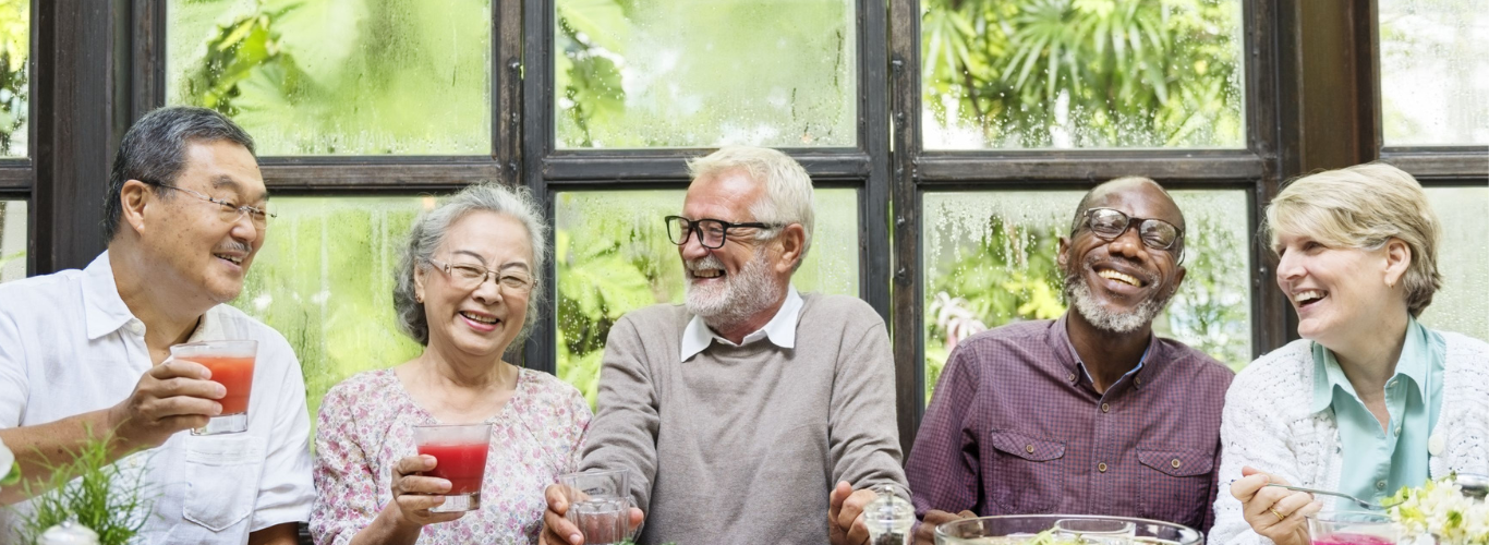 Older adults eating dinner together