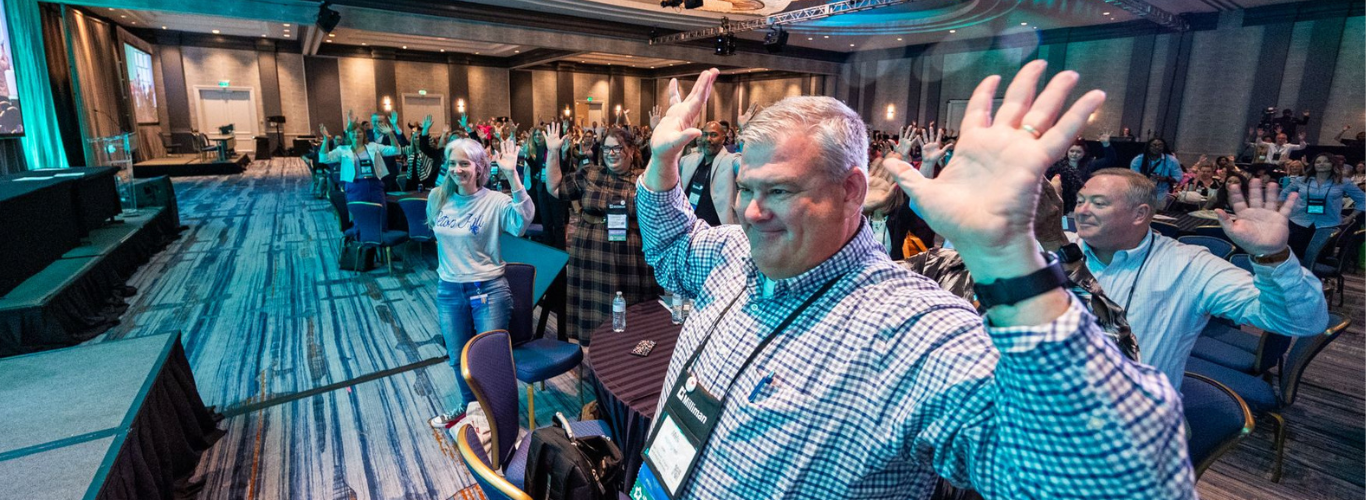 Audience members applaud at the 2025 HCBS Conference